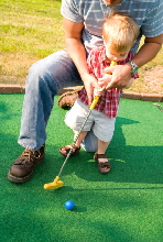 Father and child utilising one of our Crazy Golf Courses